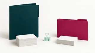 Separate tall petrol and shorter raspberry folders with their own blank document bundles.
